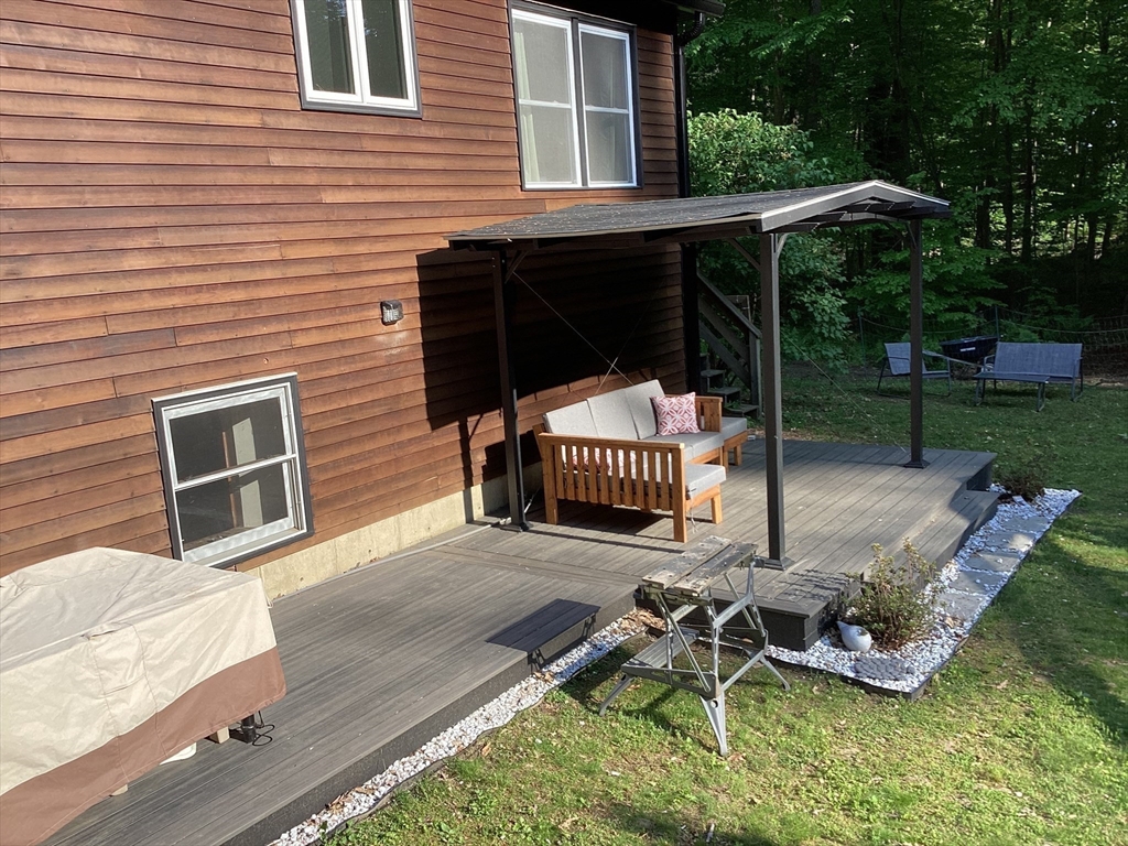 15 Gulf Road Pelham, MA 01002 - Photo 31 of 42 a view of a chair and table in backyard of the house