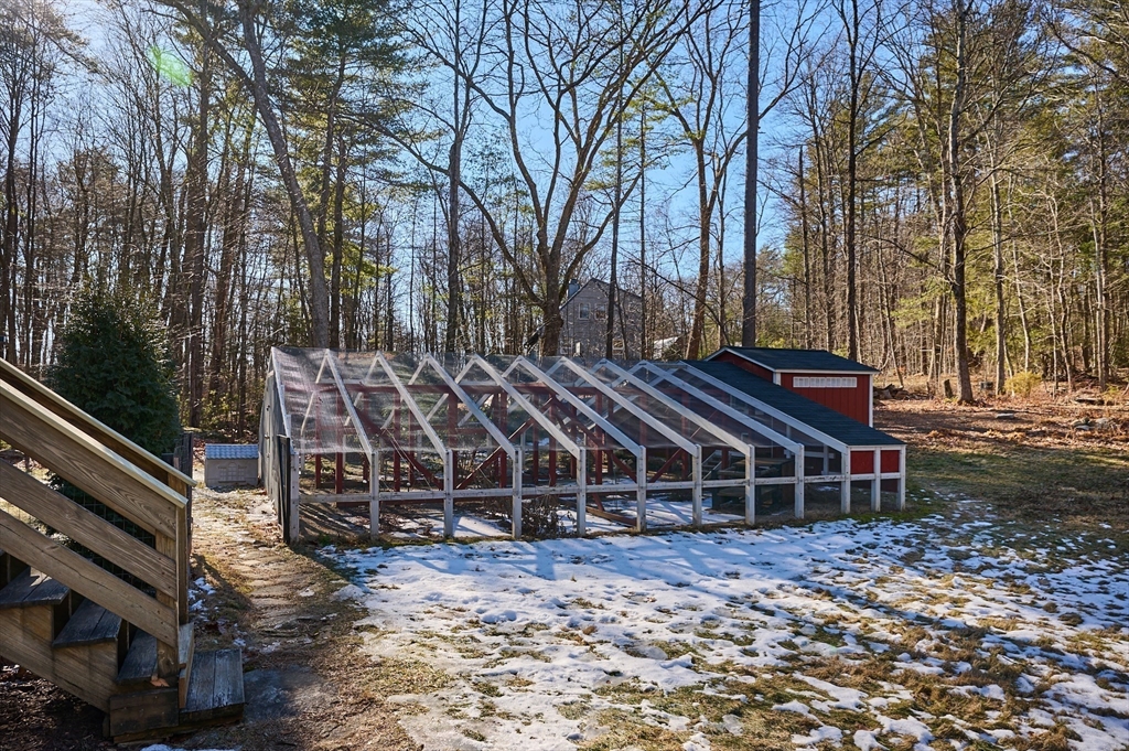 15 Gulf Road Pelham, MA 01002 - Photo 34 of 42 a wooden deck with trees in front of it