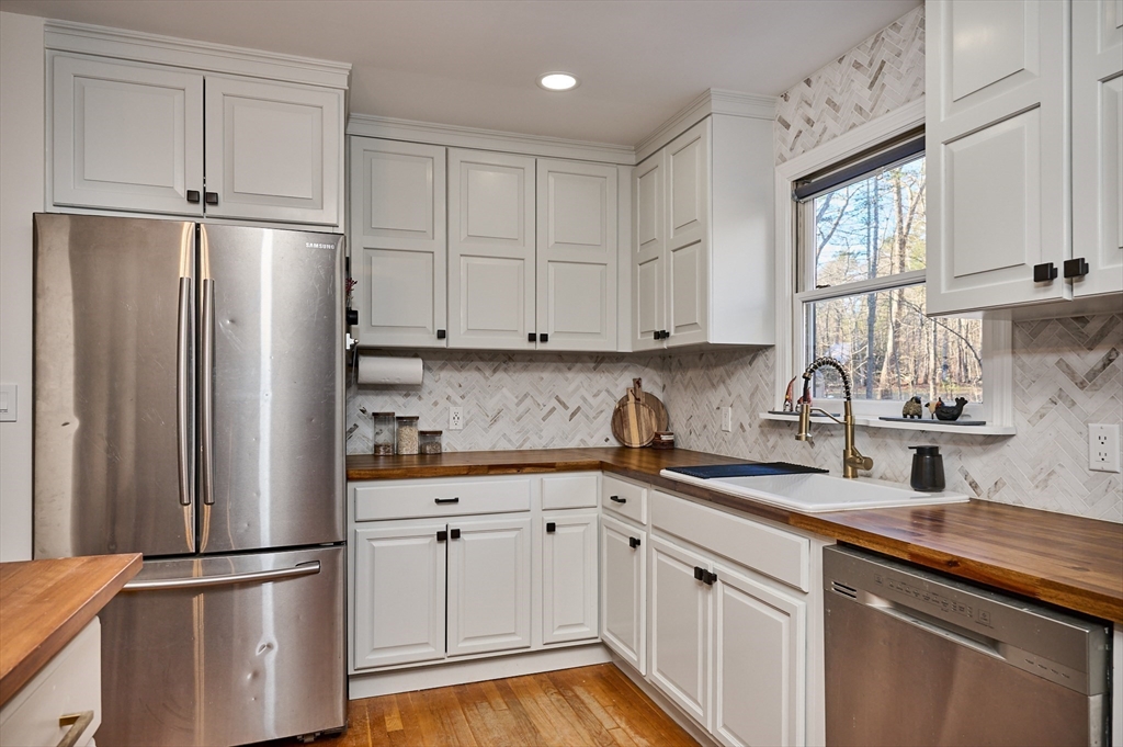 15 Gulf Road Pelham, MA 01002 - Photo 7 of 42 a kitchen with stainless steel appliances granite countertop a refrigerator sink and cabinets