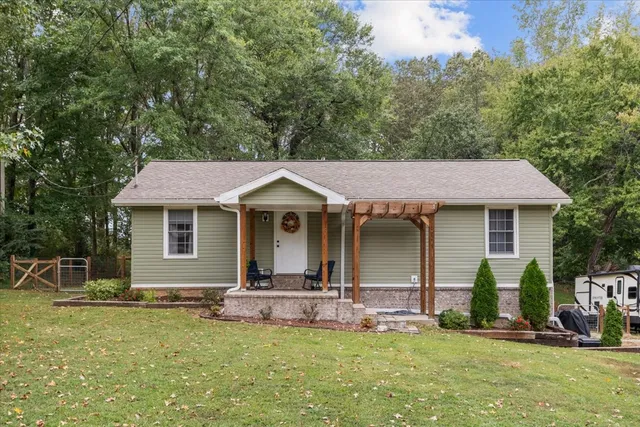a front view of a house with a yard