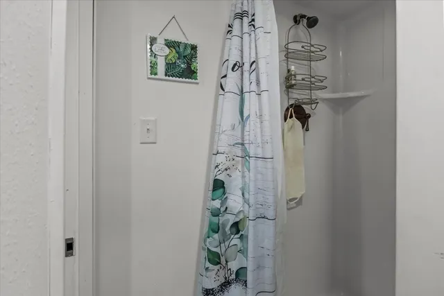 a view of a house with backyard sitting area and garden