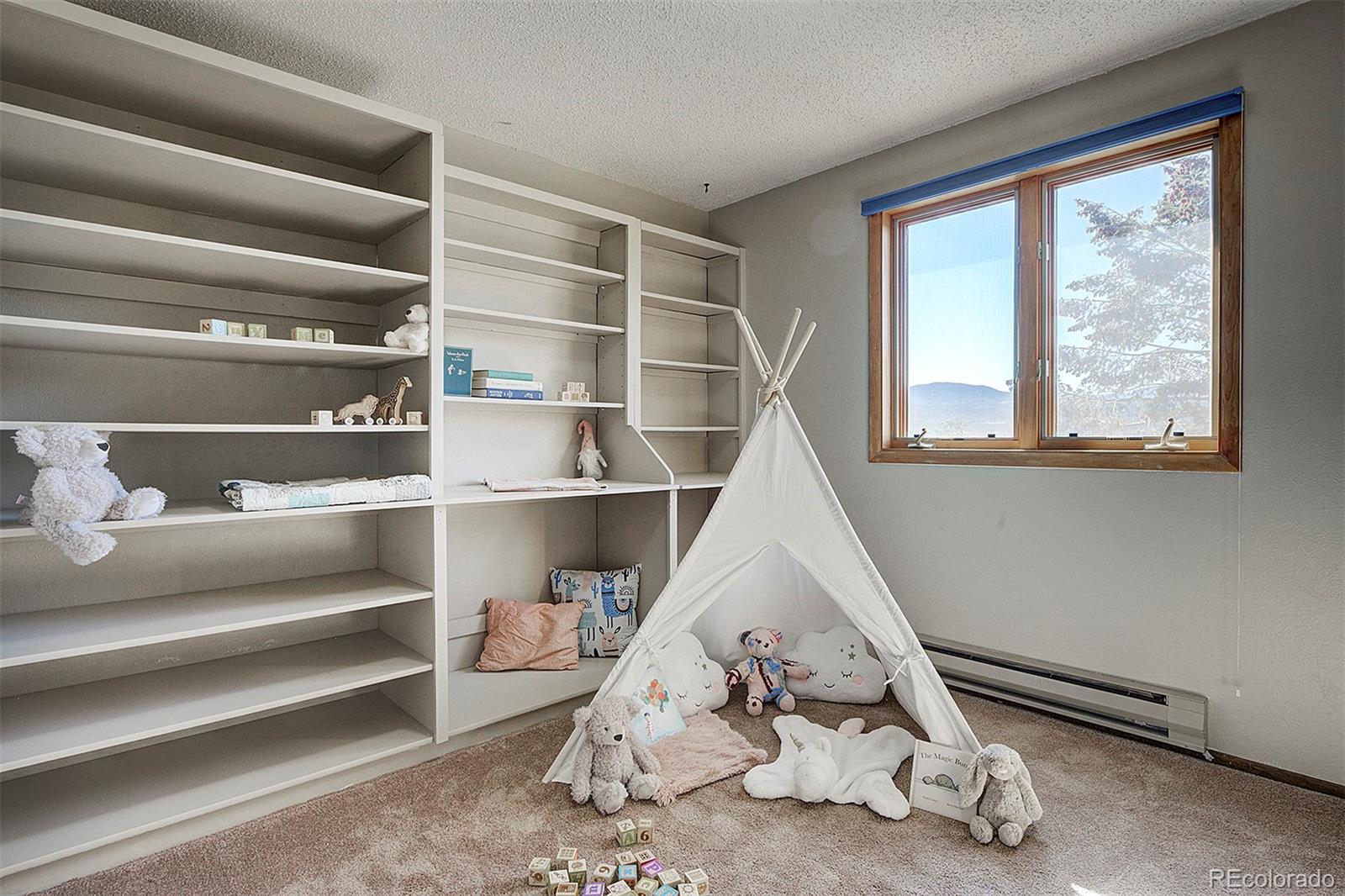 6561 Ridgeview Drive Morrison, CO 80465 - Photo 14 of 36 a room with a wooden floor pool table and chairs
