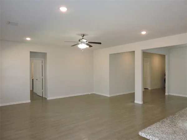 a view of a kitchen with a sink and a window