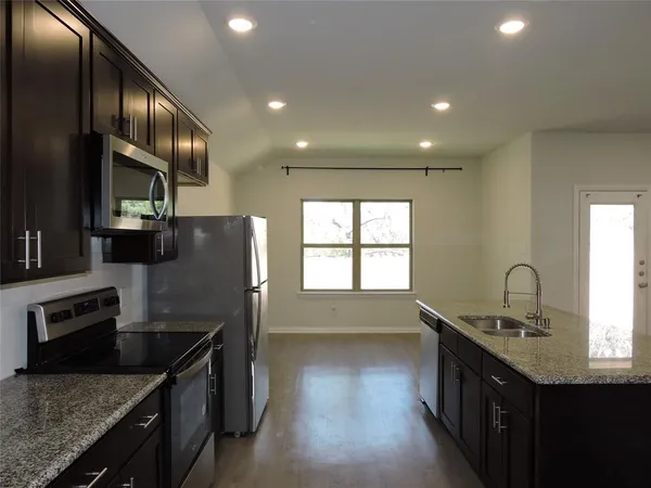 an empty room with wooden floor