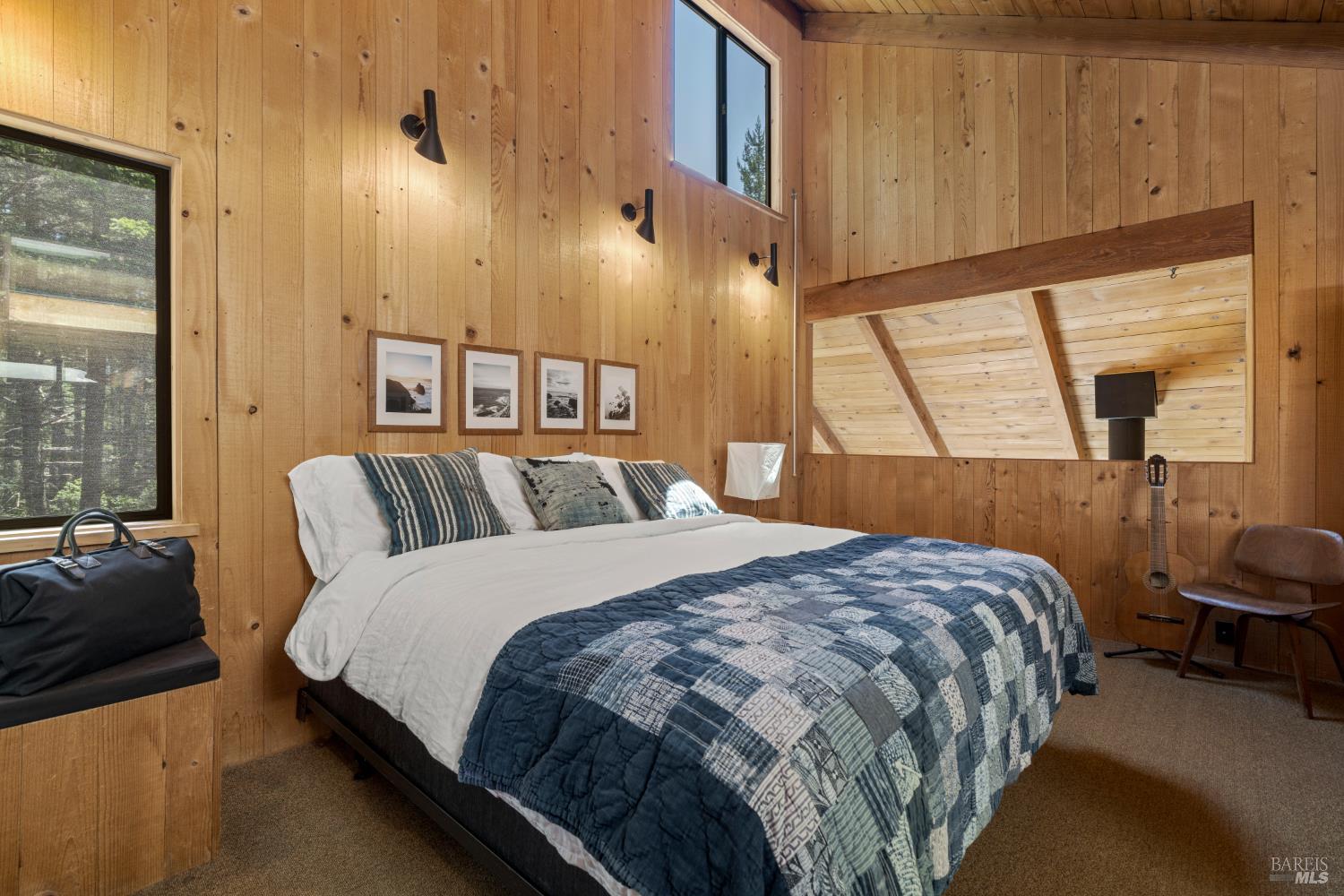 36778 Timber Ridge Road The Sea Ranch, CA 95497 - Photo 34 of 44 a bedroom with a bed a mirror and a window