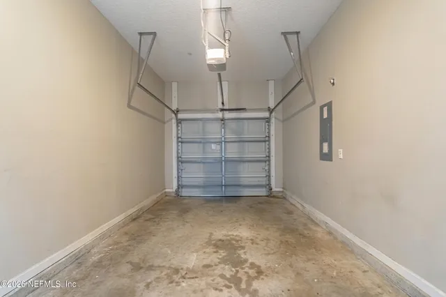 a view of room that has a white stove next to a window