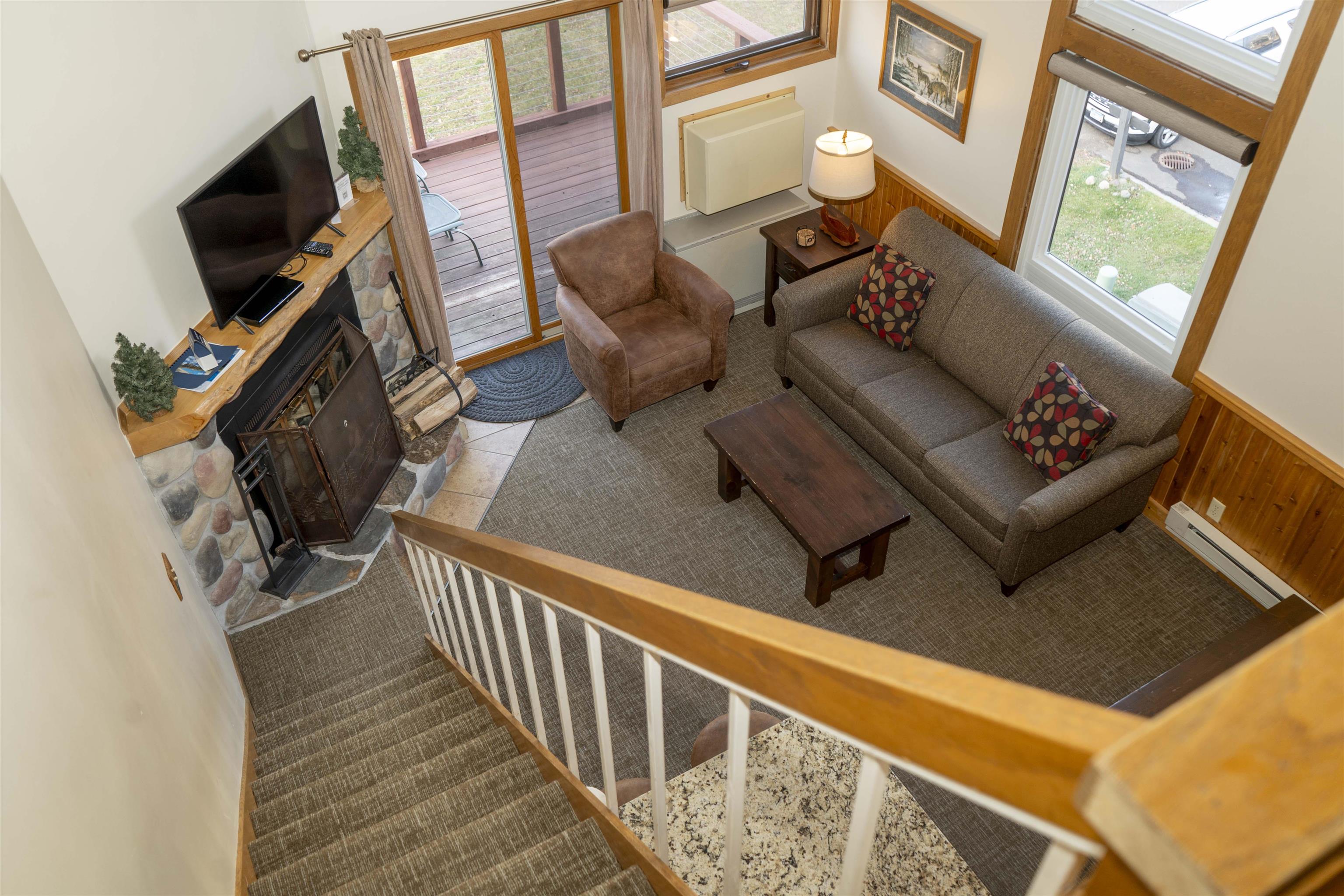 111 Bridge Run Lane, Unit 111 Lutsen, MN 55612 - Photo 20 of 48 Living area with a fireplace, baseboard heating, and tile patterned floors