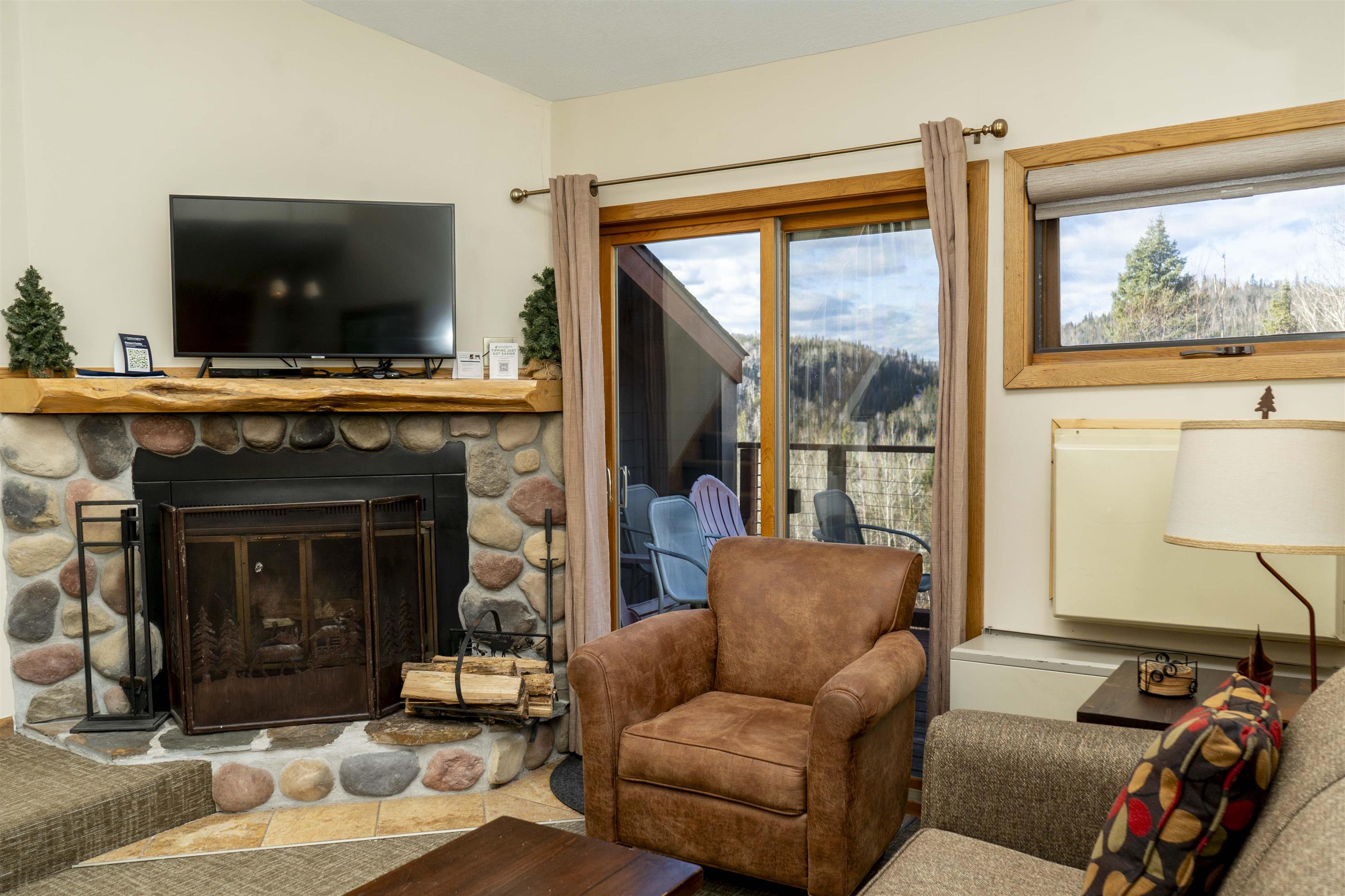 111 Bridge Run Lane, Unit 111 Lutsen, MN 55612 - Photo 27 of 48 Living room featuring a fireplace