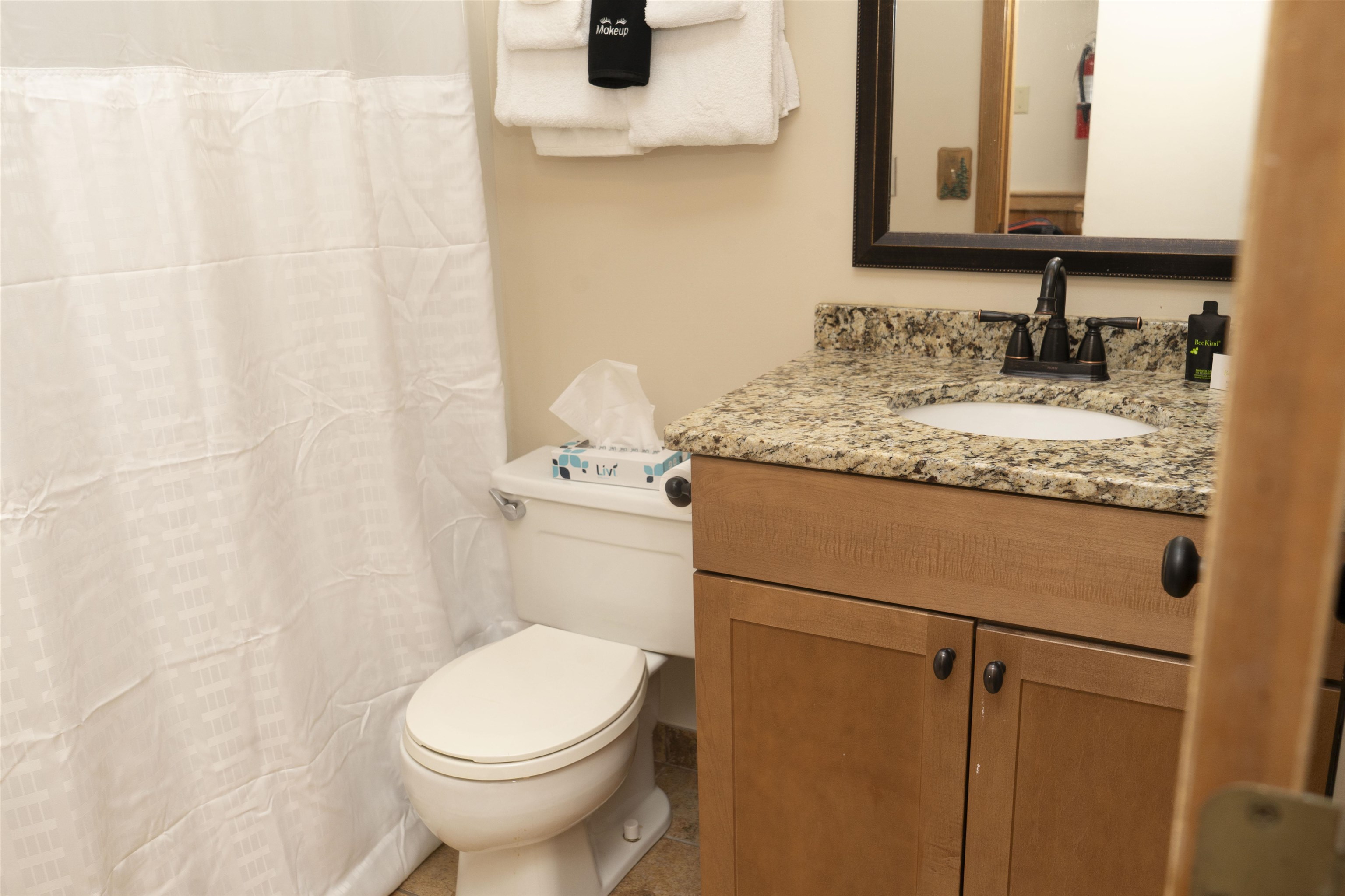111 Bridge Run Lane, Unit 111 Lutsen, MN 55612 - Photo 30 of 48 Full bathroom featuring a shower with shower curtain and vanity