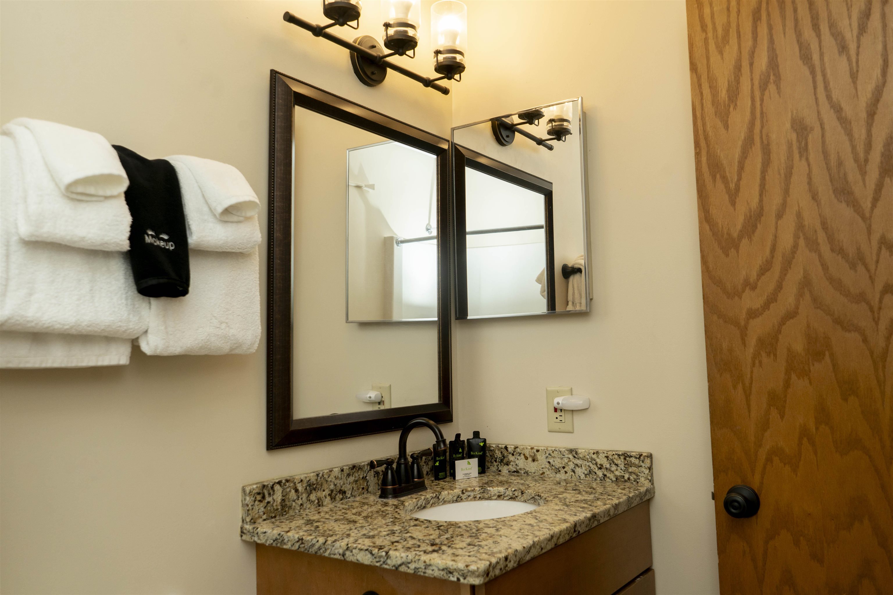 111 Bridge Run Lane, Unit 111 Lutsen, MN 55612 - Photo 32 of 48 Bathroom featuring vanity and a chandelier