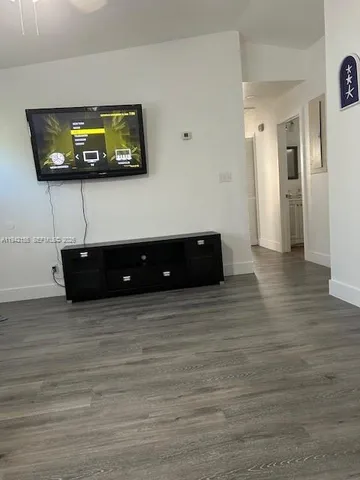 a bathroom with a sink vanity mirror and toilet