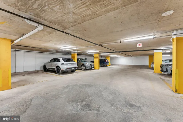 a view of parking garage with cars
