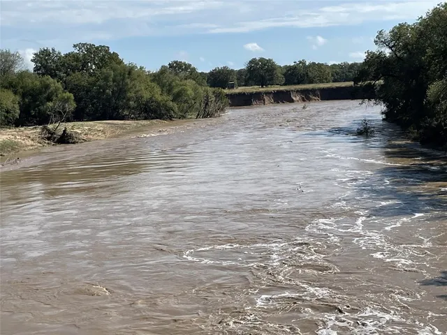 a view of a road with a yard