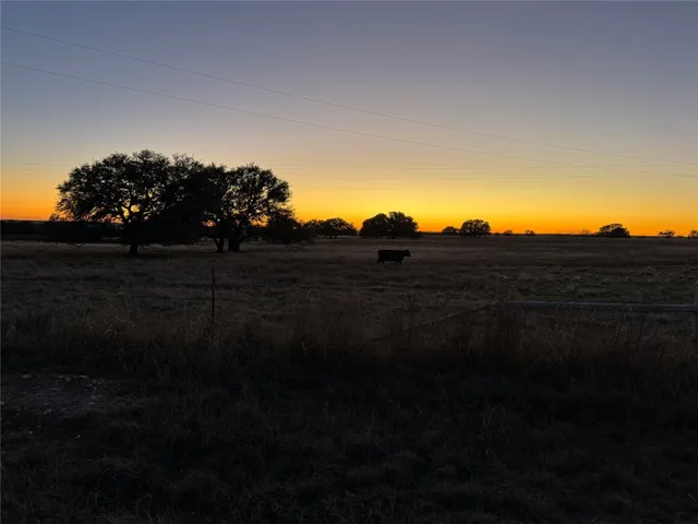 a view of lake with houses in the back