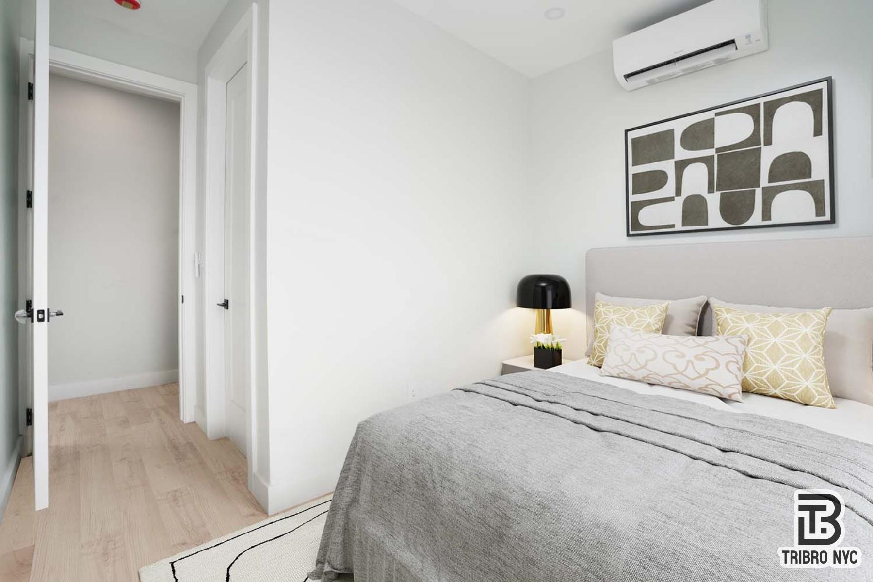 92 Manhattan Avenue, Unit 4X Brooklyn, NY 11206 - Photo 5 of 7 a bedroom with a bed and a window