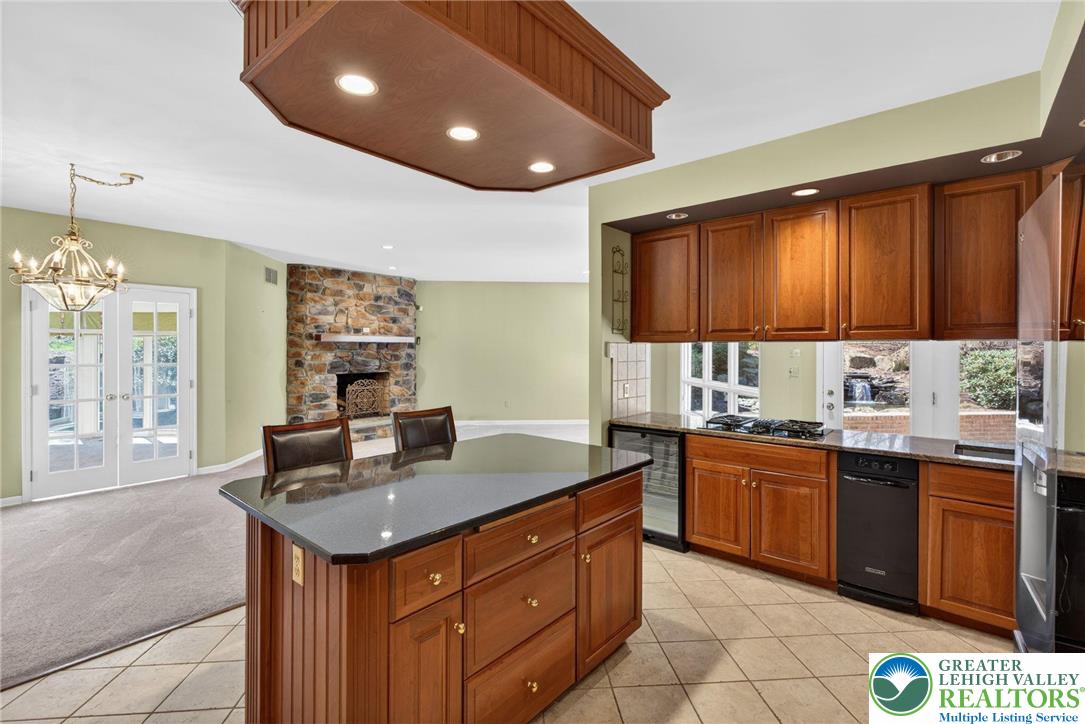 3190 Sheffield Drive Emmaus, PA 18049 - Photo 15 of 43 a kitchen with granite countertop a sink and cabinets