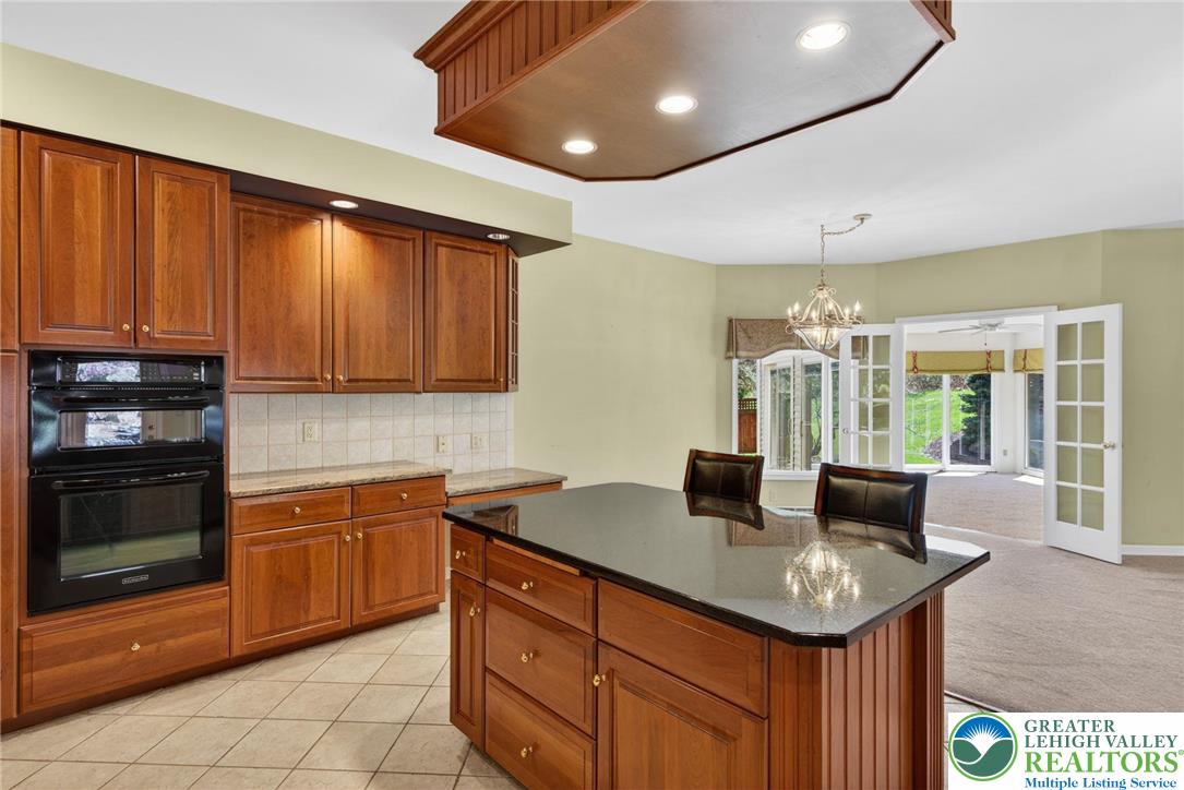 3190 Sheffield Drive Emmaus, PA 18049 - Photo 17 of 43 a kitchen with granite countertop a sink and cabinets