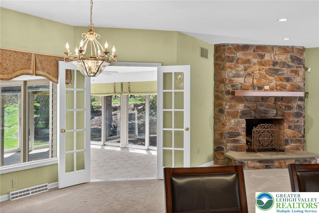 3190 Sheffield Drive Emmaus, PA 18049 - Photo 20 of 43 a room with fireplace and chandelier