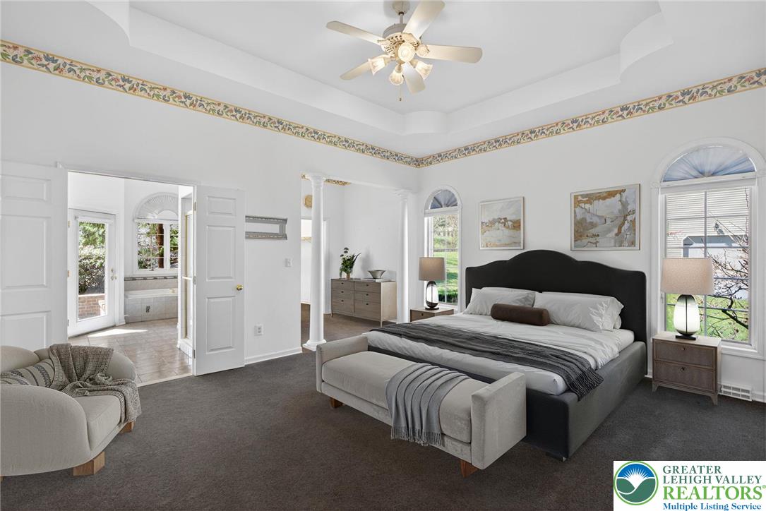 3190 Sheffield Drive Emmaus, PA 18049 - Photo 22 of 43 a spacious bedroom with a bed and ceiling fan