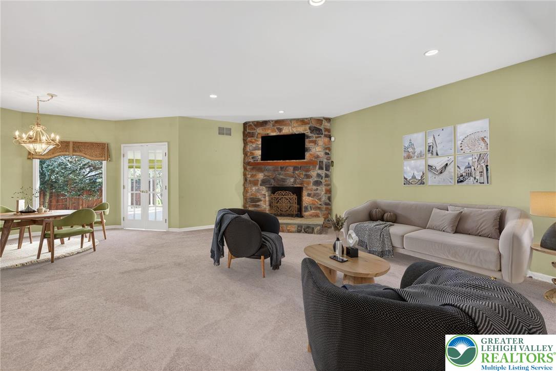 3190 Sheffield Drive Emmaus, PA 18049 - Photo 25 of 43 a living room with furniture and a fireplace