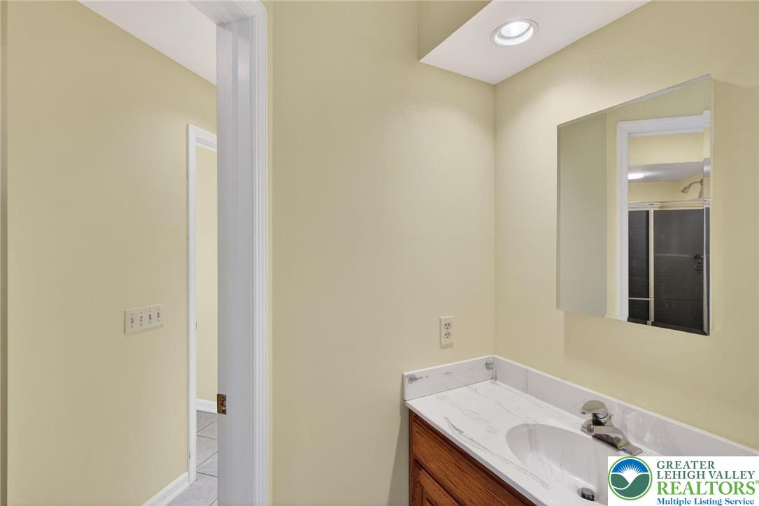 3190 Sheffield Drive Emmaus, PA 18049 - Photo 29 of 43 a bathroom with a sink and a mirror