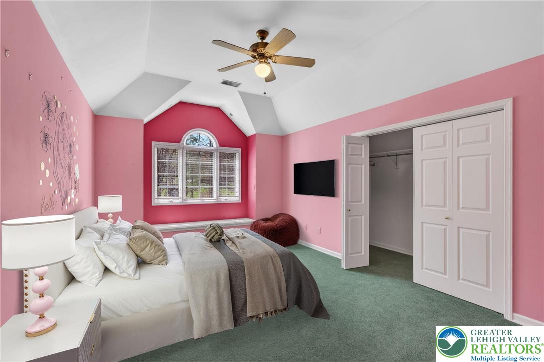 3190 Sheffield Drive Emmaus, PA 18049 - Photo 31 of 43 a bedroom with a bed and a chandelier