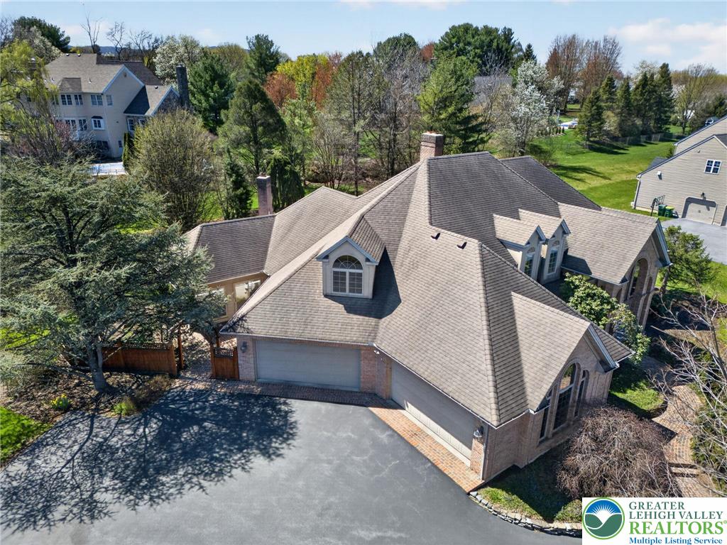 3190 Sheffield Drive Emmaus, PA 18049 - Photo 41 of 43 a view of a white house next to a yard with large trees