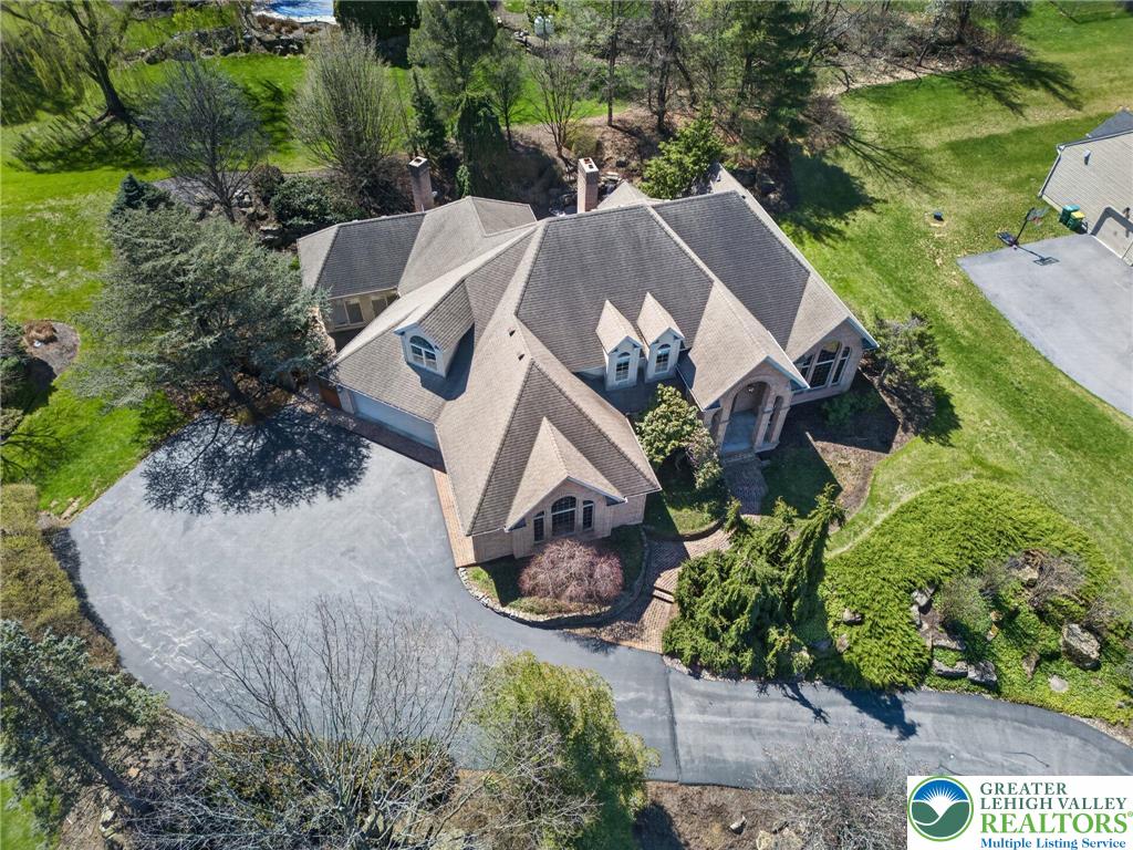 3190 Sheffield Drive Emmaus, PA 18049 - Photo 42 of 43 an aerial view of a house with a yard and large trees