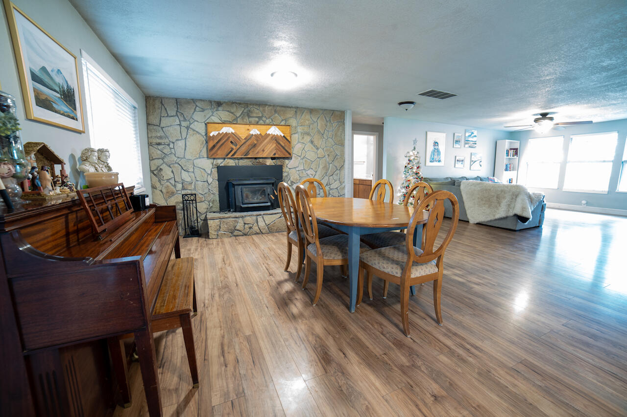 63410 Hamehook Road Bend, OR 97701 - Photo 15 of 35 a view of a dining room with furniture and wooden floor