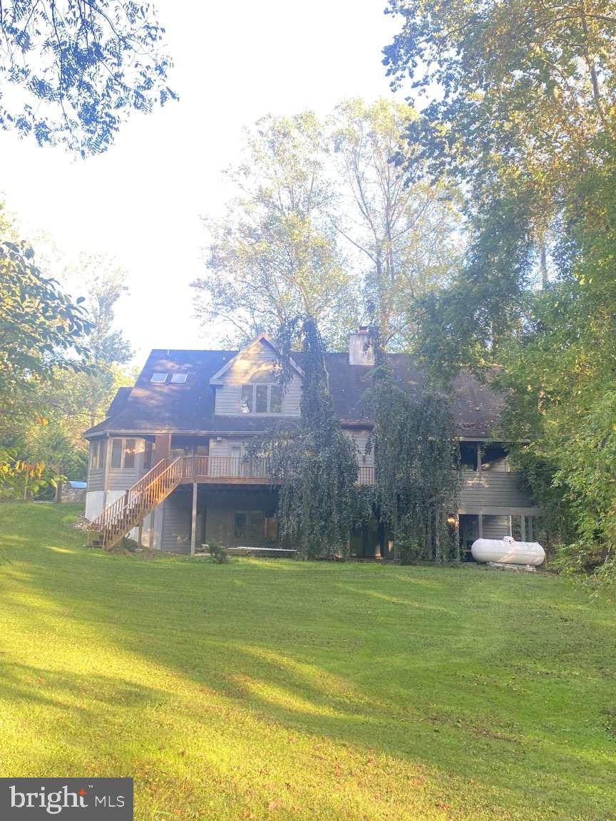 44 Frederick Way Kirkwood, PA 17536 - Photo 2 of 50 a view of a house with a big yard and large trees