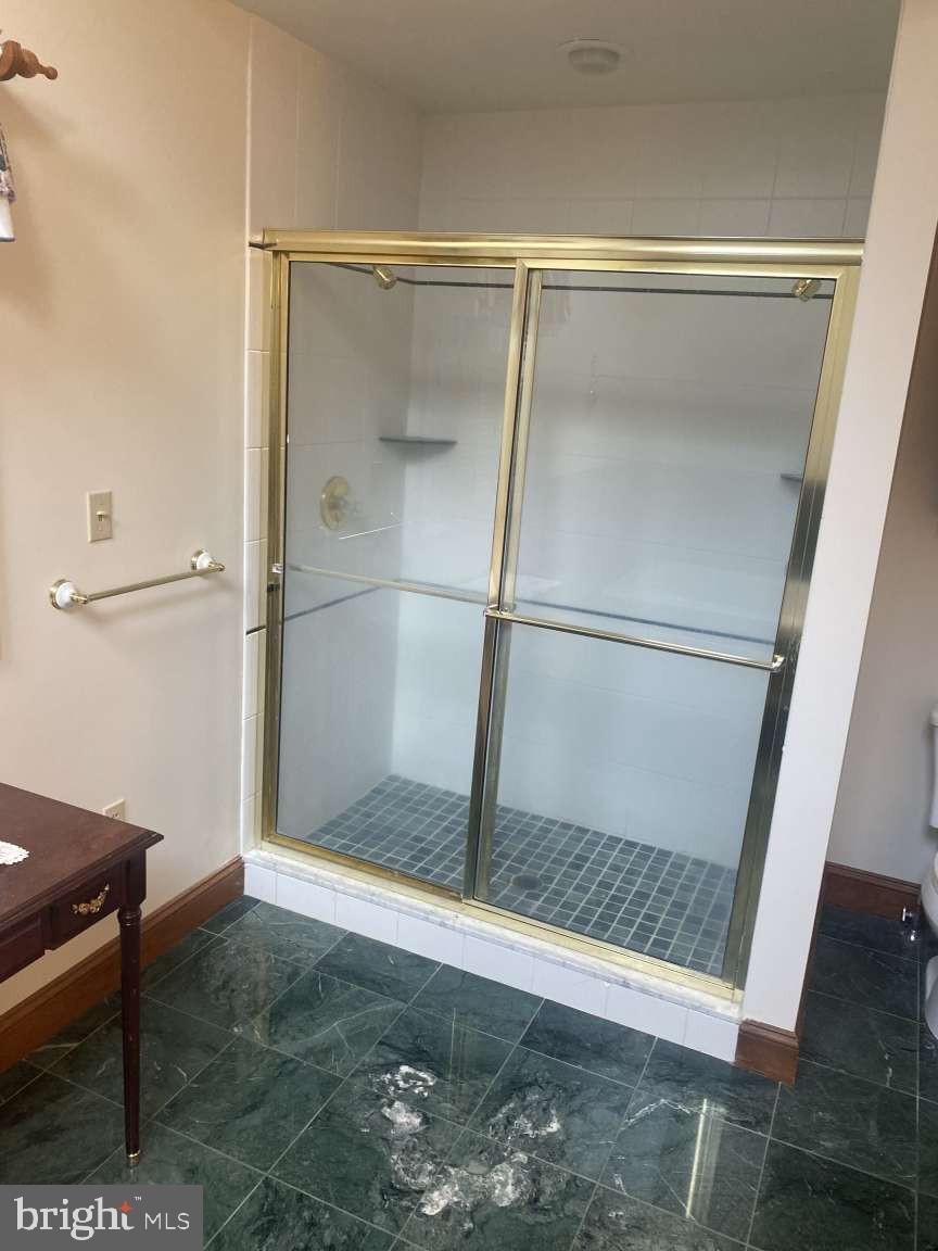 44 Frederick Way Kirkwood, PA 17536 - Photo 36 of 50 a bathroom with a glass shower door