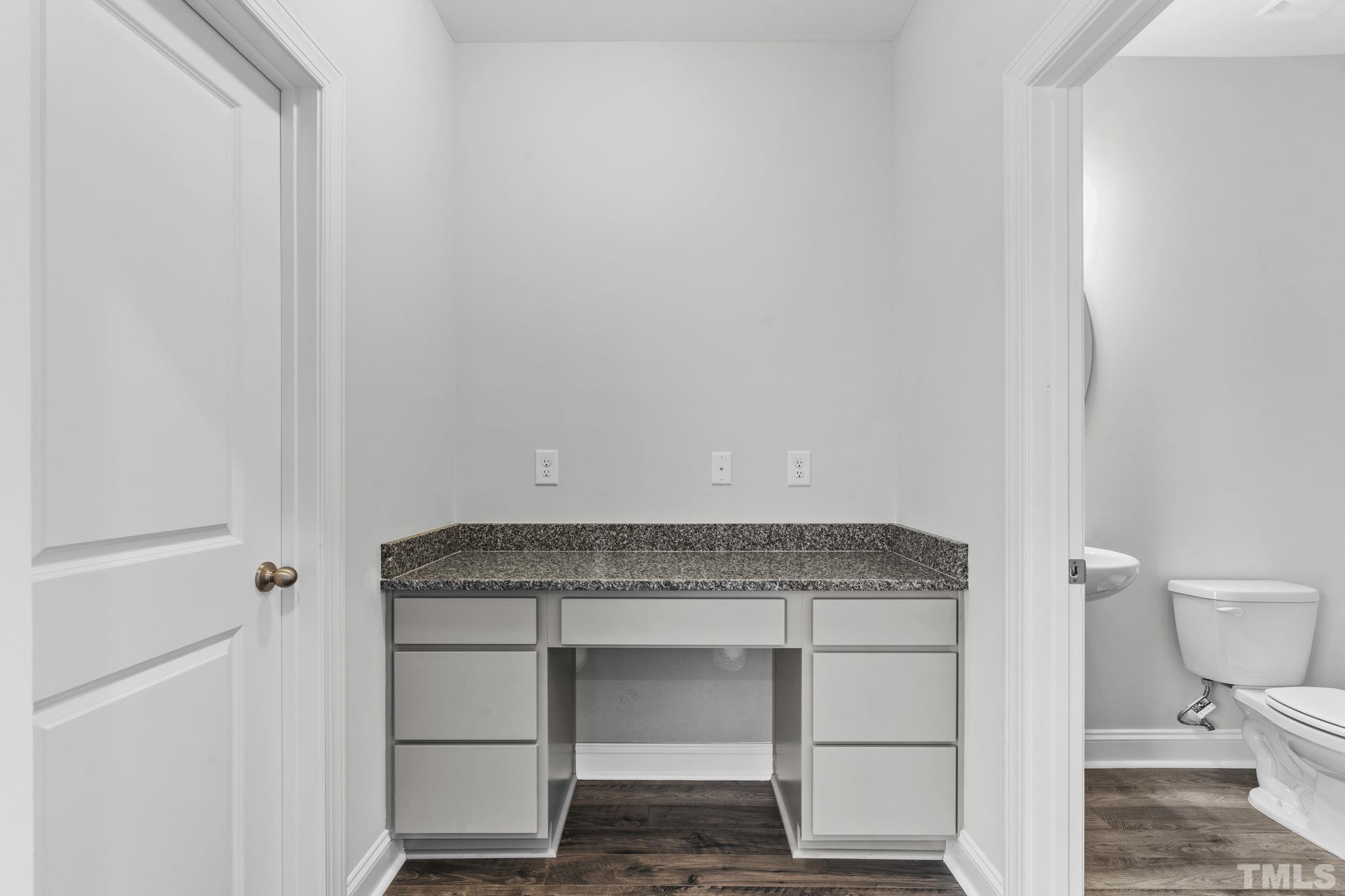 1150 Breadsell Lane Wake Forest, NC 27587 - Photo 13 of 33 a bathroom with a sink and a toilet