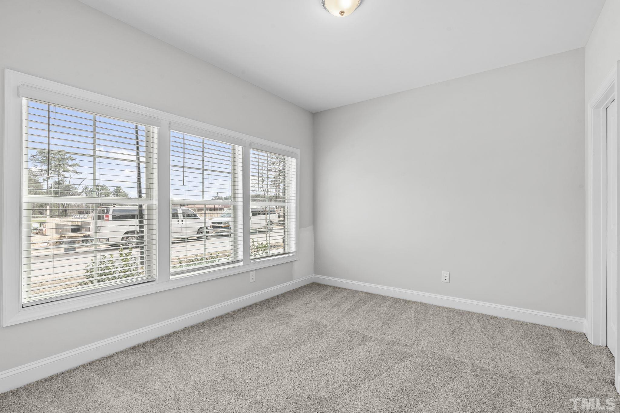 1150 Breadsell Lane Wake Forest, NC 27587 - Photo 18 of 33 an empty room with a window