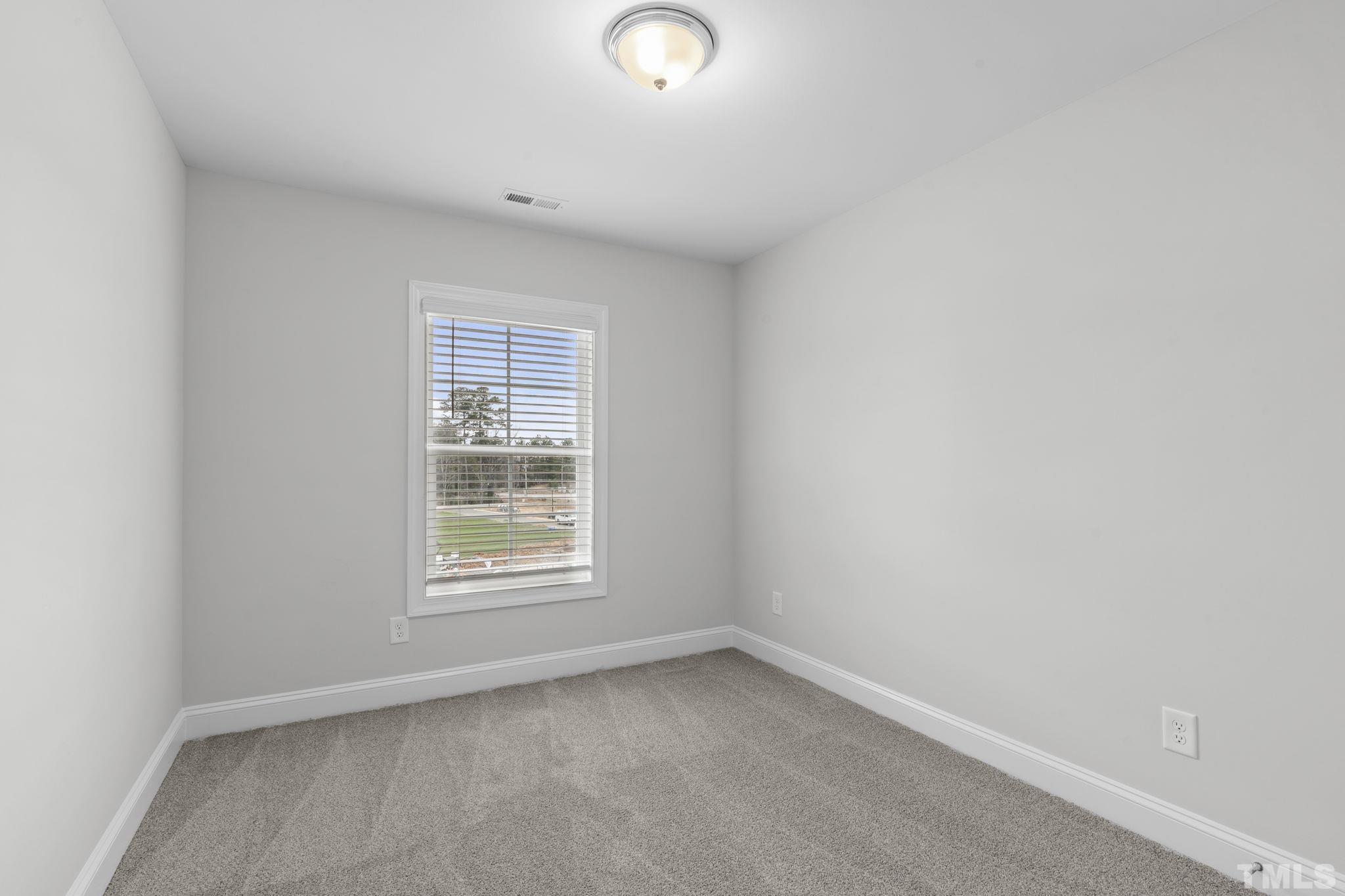 1150 Breadsell Lane Wake Forest, NC 27587 - Photo 20 of 33 an empty room with a window