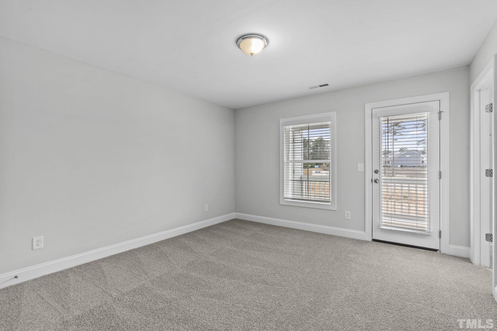 1150 Breadsell Lane Wake Forest, NC 27587 - Photo 21 of 33 an empty room with windows