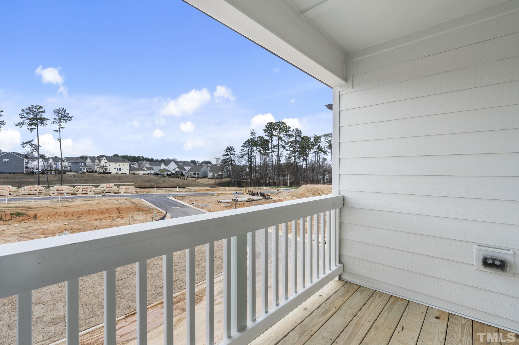 1150 Breadsell Lane Wake Forest, NC 27587 - Photo 28 of 33 a view of a balcony with wooden floor and city view
