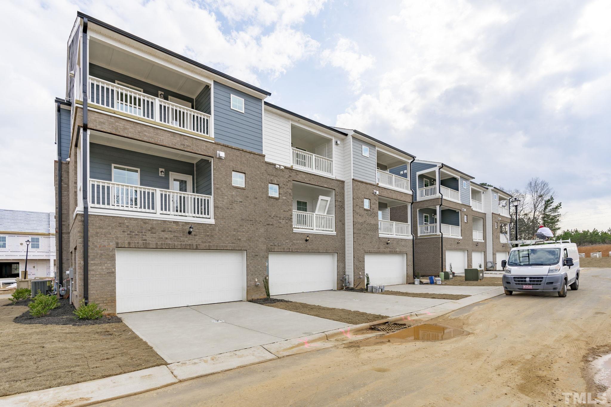 1150 Breadsell Lane Wake Forest, NC 27587 - Photo 29 of 33 a front view of a building with cars parked