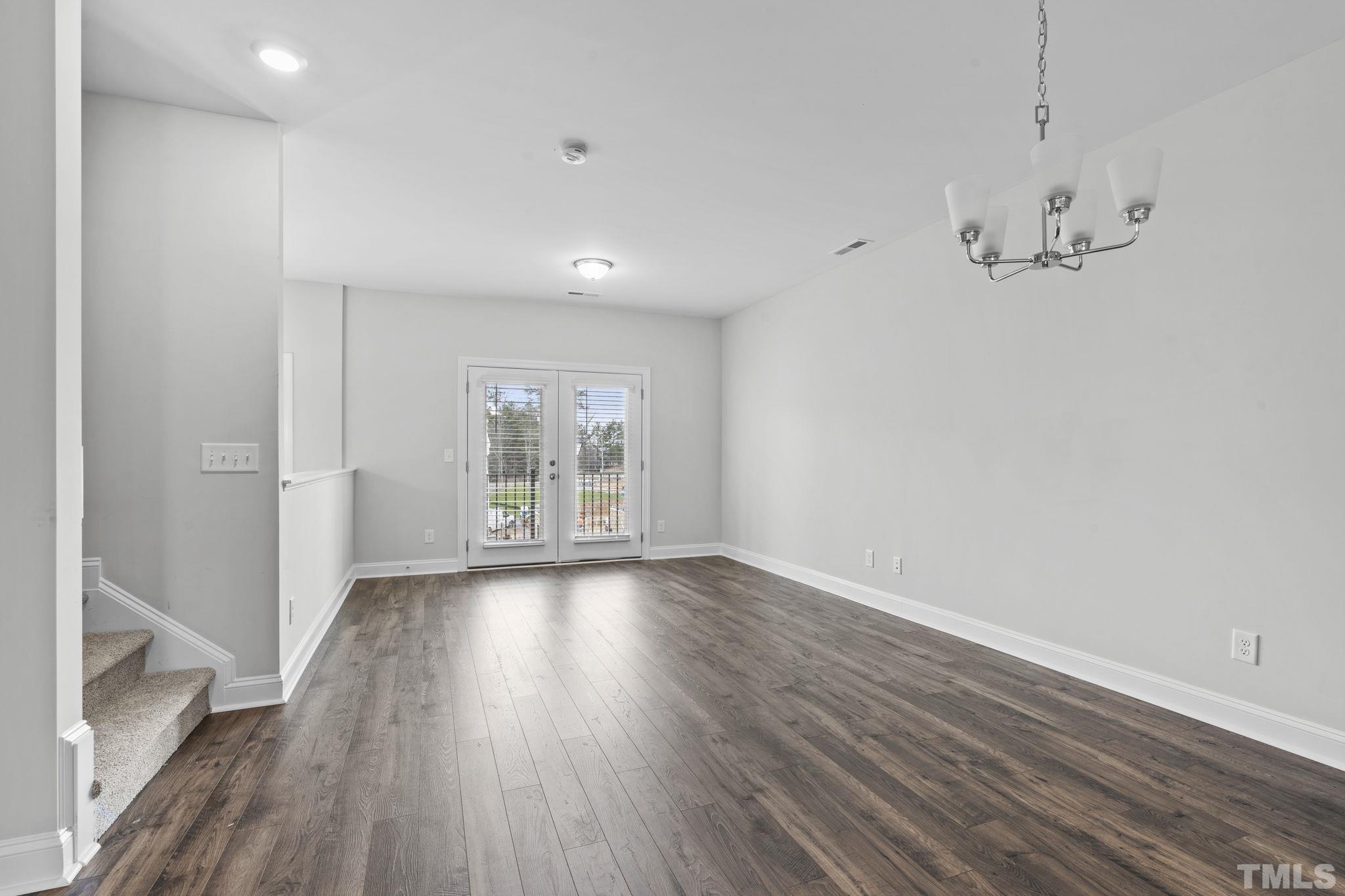 1150 Breadsell Lane Wake Forest, NC 27587 - Photo 7 of 33 wooden floor in an empty room with a window