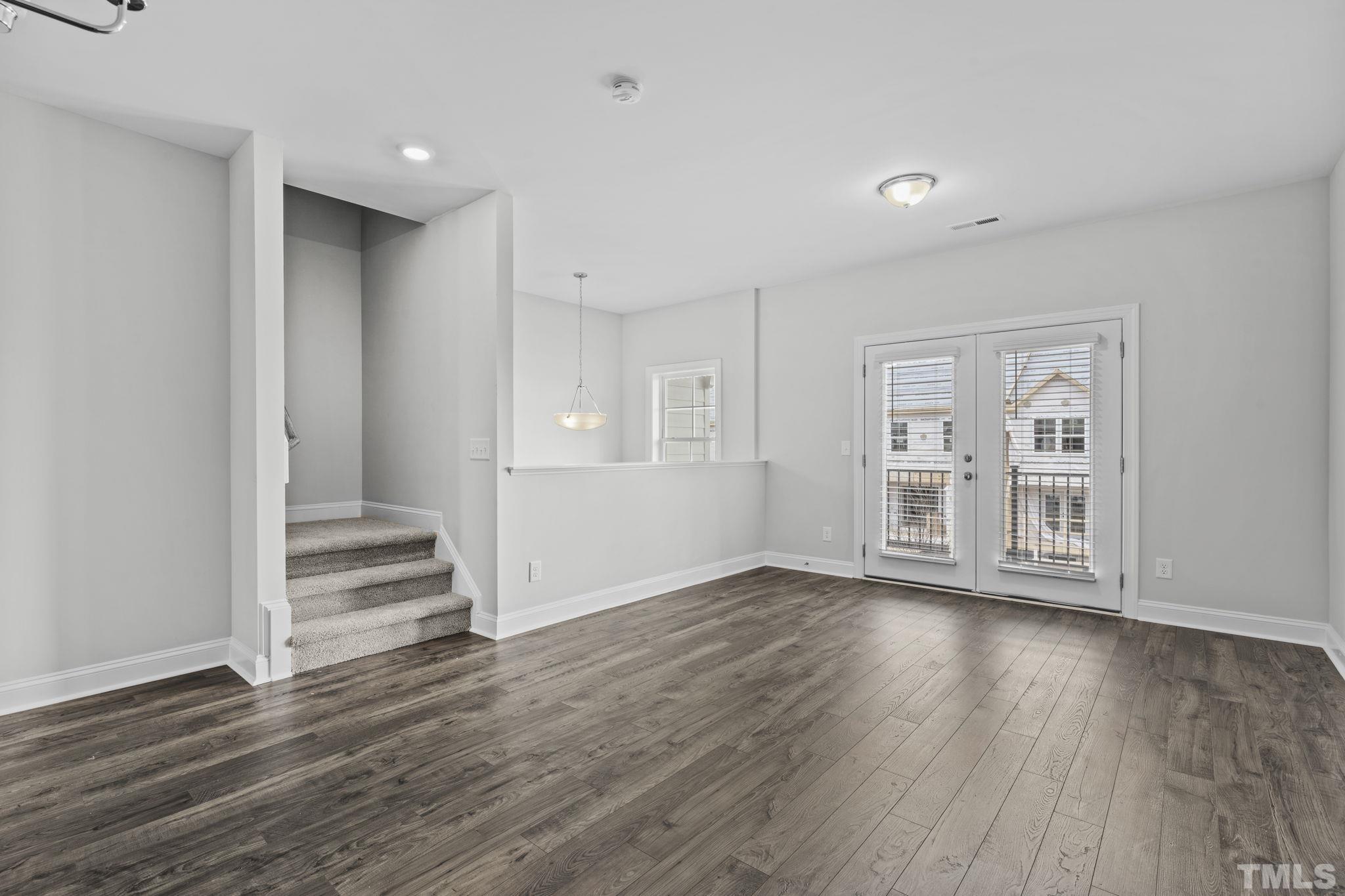 1150 Breadsell Lane Wake Forest, NC 27587 - Photo 8 of 33 a view of an empty room with wooden floor and window