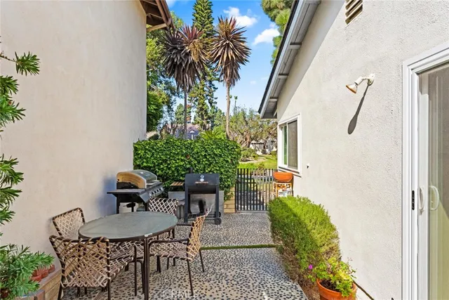 a outdoor dining space with furniture