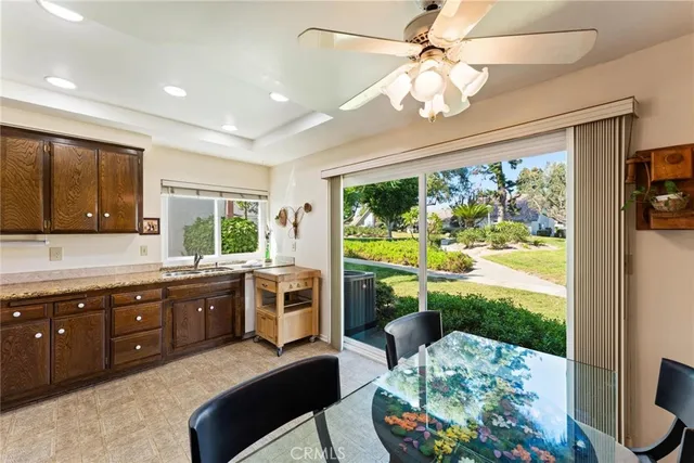 a kitchen with a stove a sink and a refrigerator