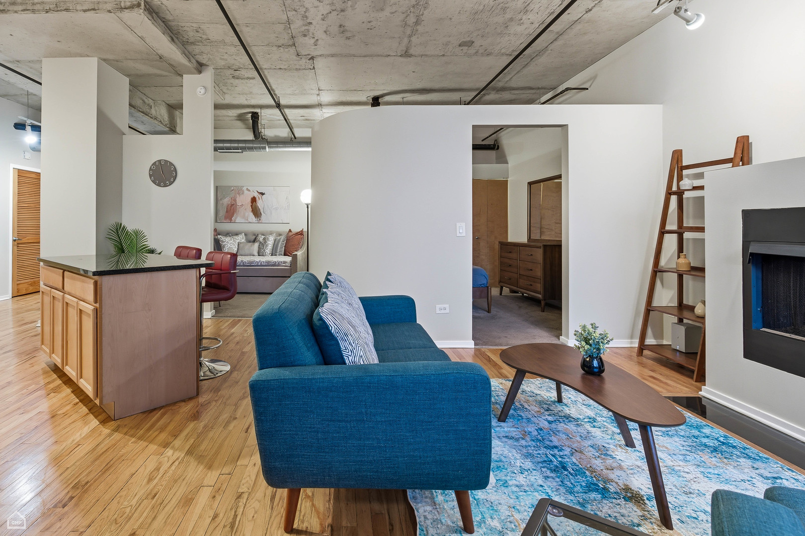 6 South Laflin Street, Unit 920 Chicago, IL 60607 - Photo 11 of 17 a living room with furniture and a flat screen tv