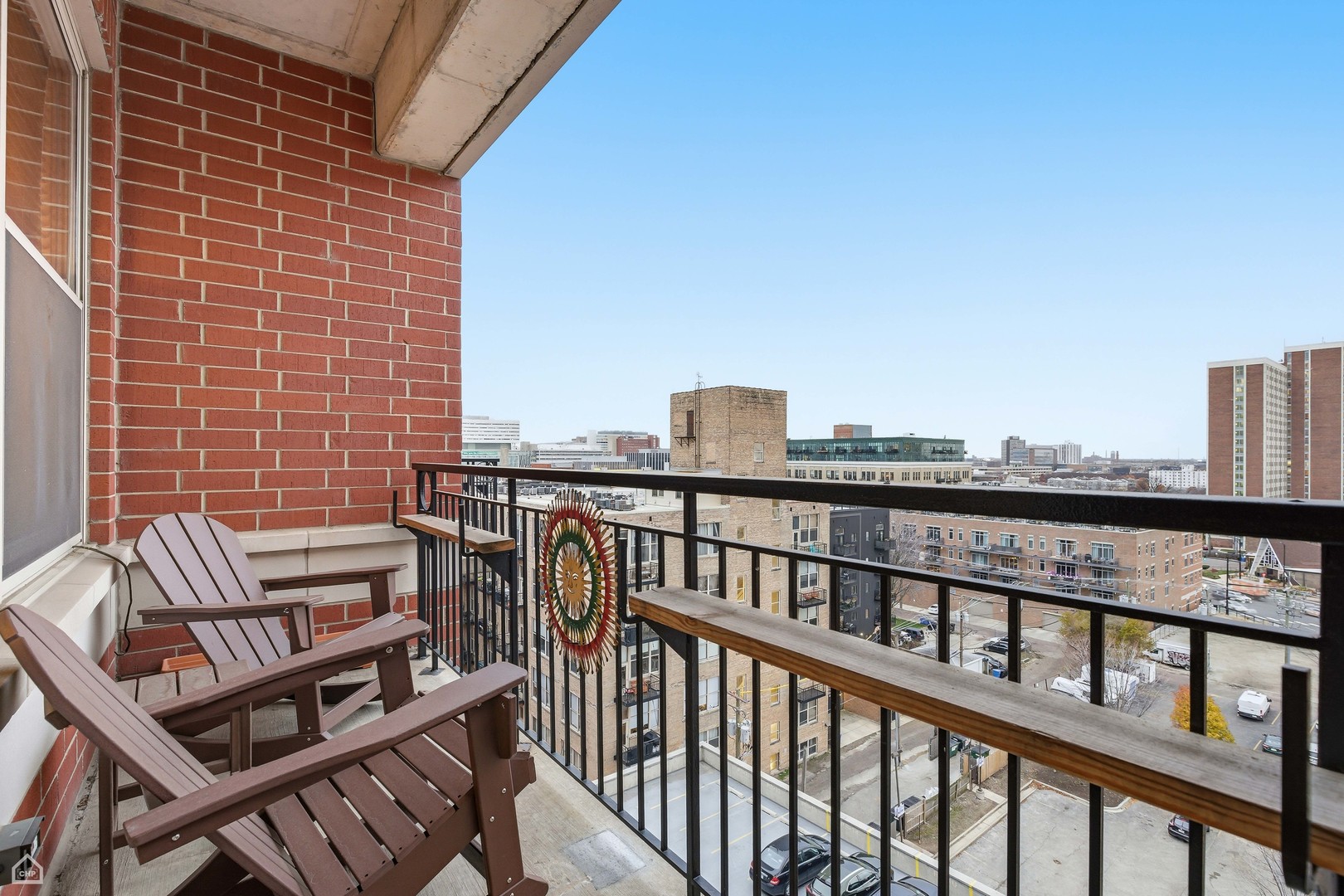 6 South Laflin Street, Unit 920 Chicago, IL 60607 - Photo 17 of 17 a view of a balcony with two chairs and wooden floor