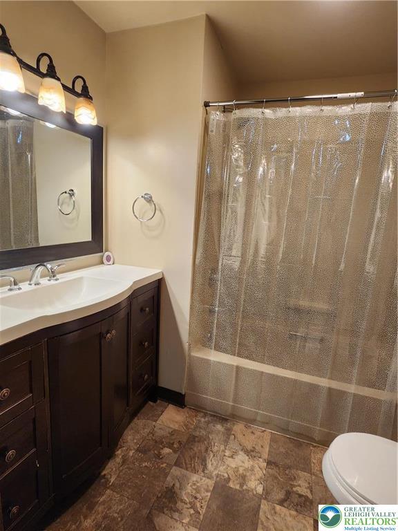 614 East Main Street Bath, PA 18014 - Photo 6 of 8 a bathroom with a double vanity sink toilet and shower