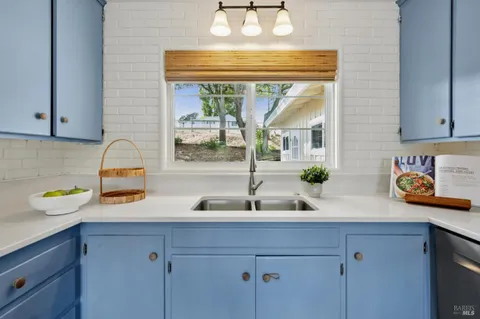 a kitchen with a sink and a window