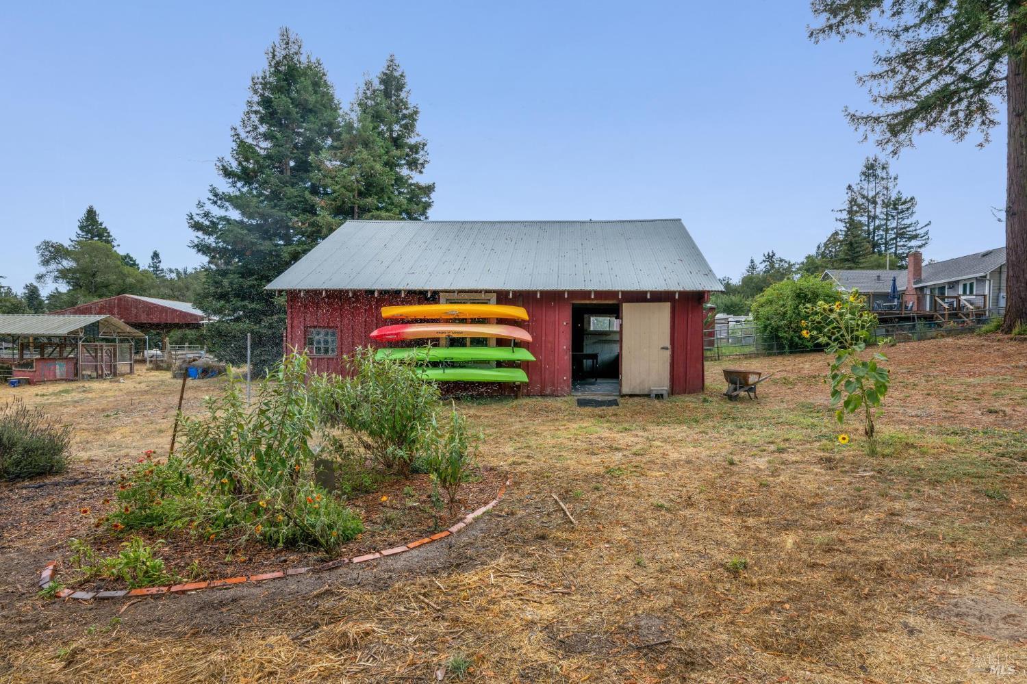 447 Sparkes Road Sebastopol, CA 95472 - Photo 35 of 44 a front view of house with yard and trees in the background