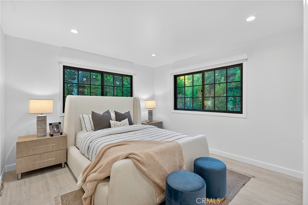 7576-7582 McGroarty Terrace Los Angeles, CA 91042 - Photo 16 of 47 a bedroom with a bed and a window