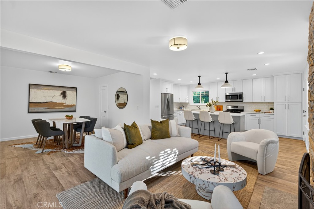 7576-7582 McGroarty Terrace Los Angeles, CA 91042 - Photo 32 of 47 a living room with lots of furniture and kitchen view