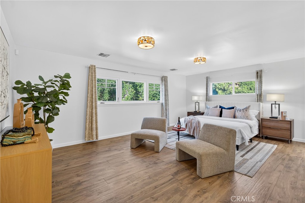 7576-7582 McGroarty Terrace Los Angeles, CA 91042 - Photo 35 of 47 a living room with furniture and a potted plant
