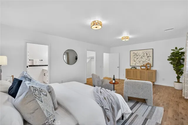 a bedroom with a bed and a couch